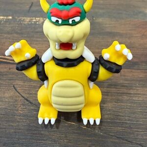 Yellow and Green Dinosaur Toy Figure